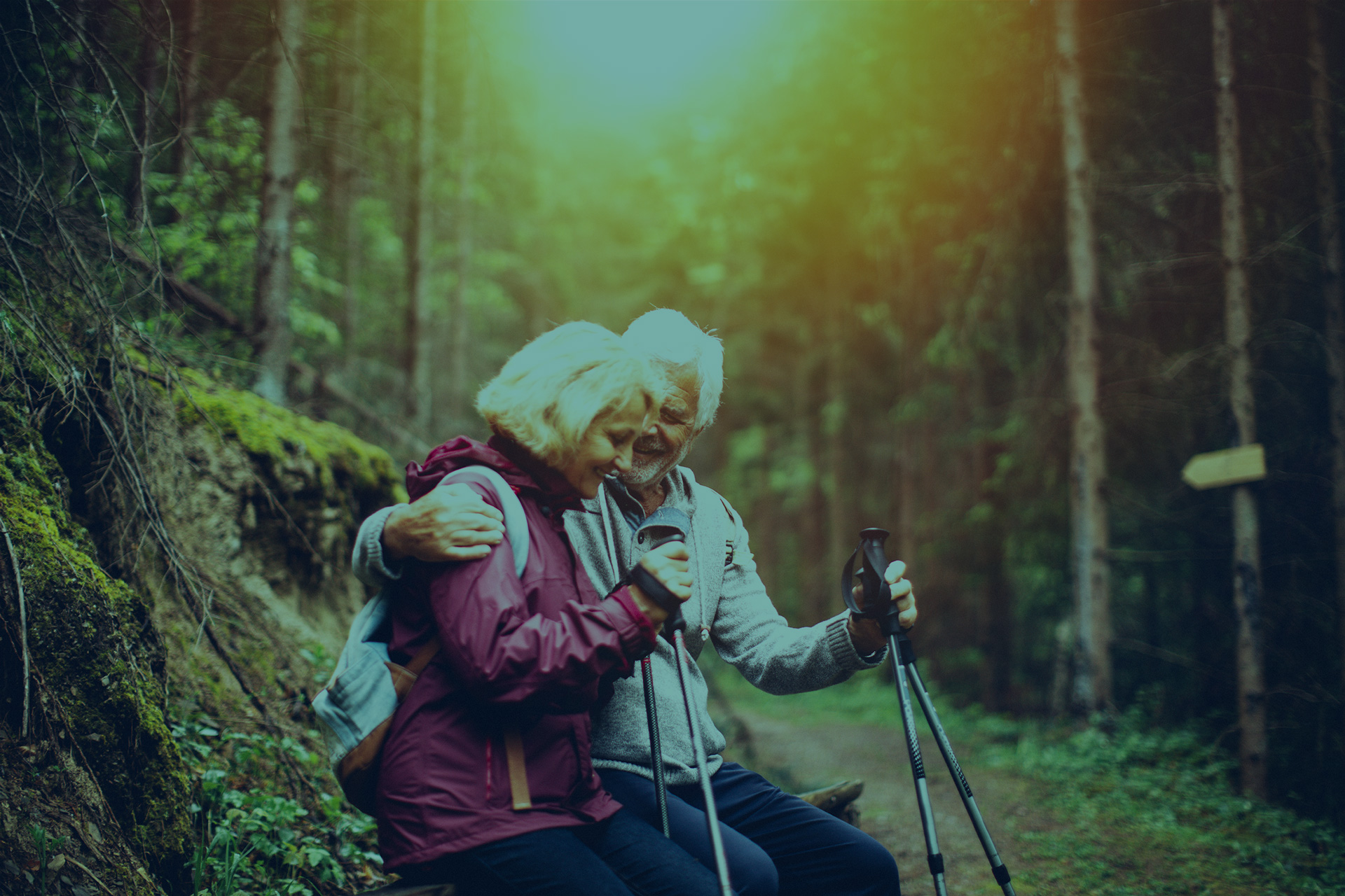 Older couple hiking. Evergreen Credit Union supports a sustainability mission.
