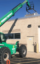 crane lifting solar panels menasha